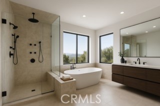 24932 Normans Way Calabasas, CA 91302 - Photo 33 of 63 a bathroom with a tub a sink and shower
