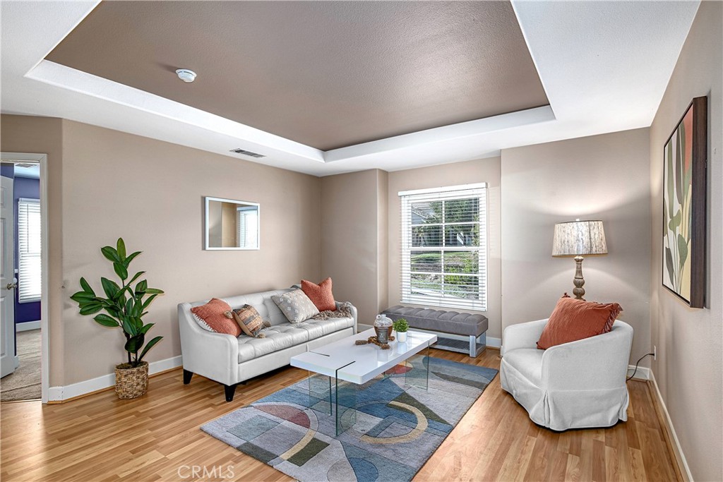 24932 Normans Way Calabasas, CA 91302 - Photo 38 of 63 a living room with furniture and a wooden floor