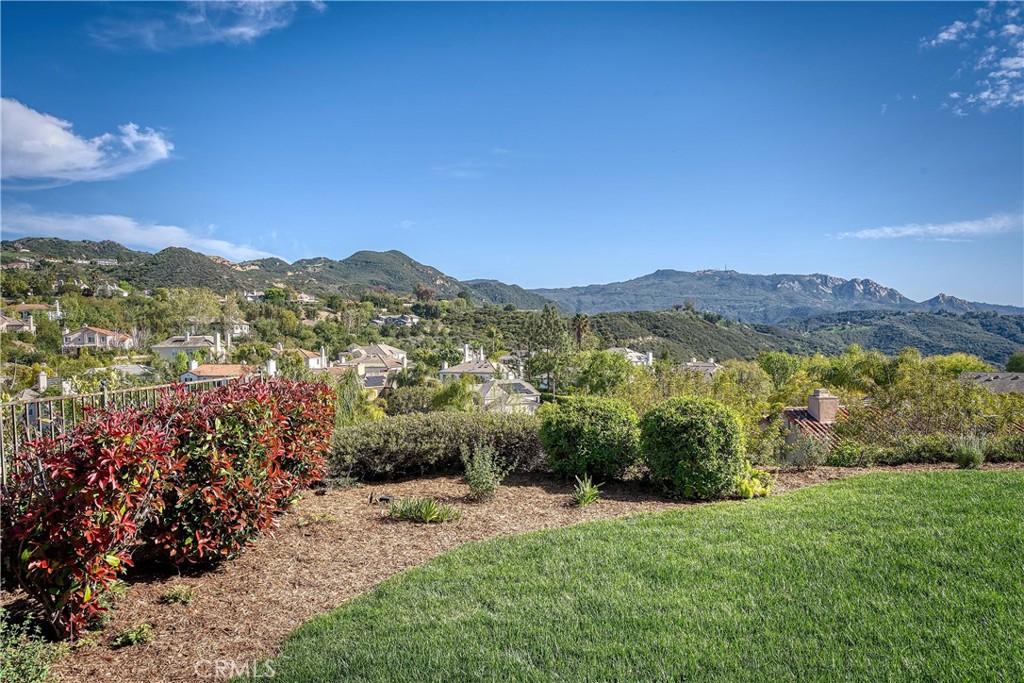 24932 Normans Way Calabasas, CA 91302 - Photo 52 of 63 a view of a lush green hillside and houses