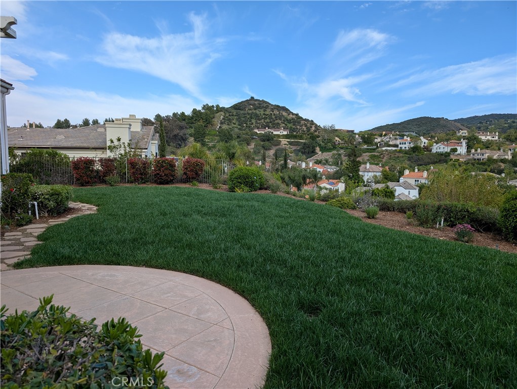 24932 Normans Way Calabasas, CA 91302 - Photo 54 of 63 a view of a field with a house in the background