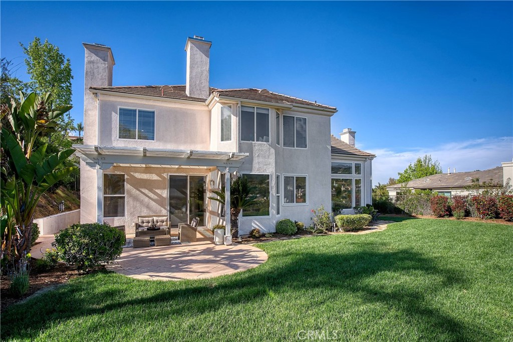24932 Normans Way Calabasas, CA 91302 - Photo 58 of 63 a front view of a house with a yard and porch