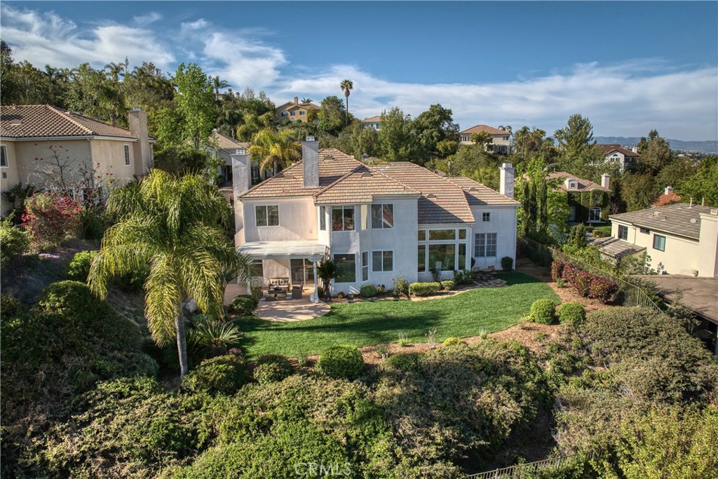 24932 Normans Way Calabasas, CA 91302 - Photo 62 of 63 a front view of a house with a garden