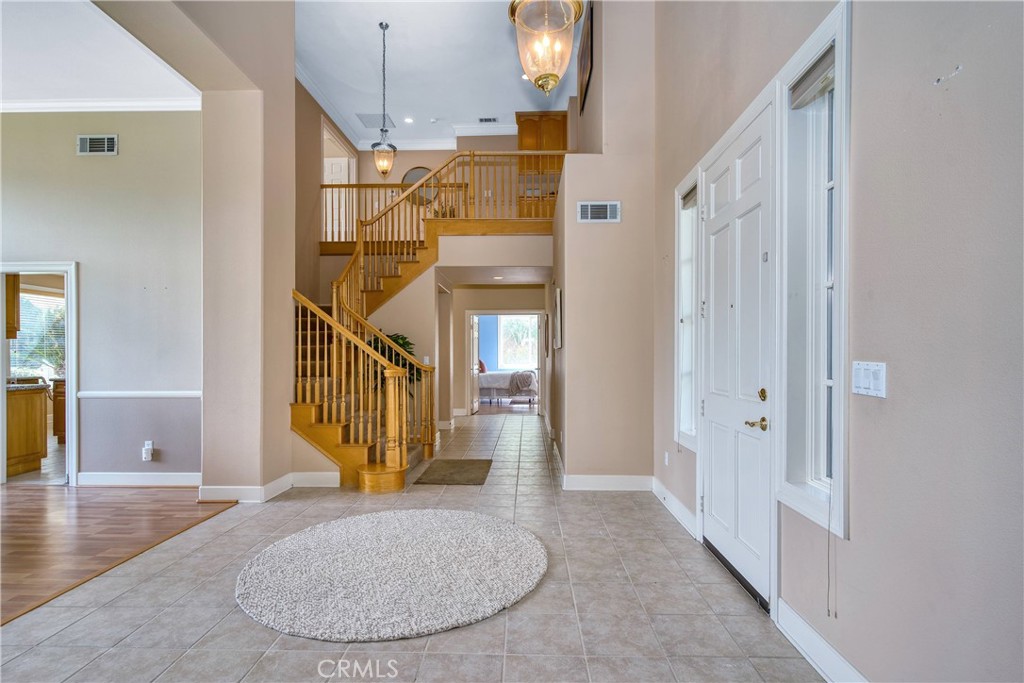 24932 Normans Way Calabasas, CA 91302 - Photo 10 of 63 a view of a livingroom with wooden floor and stairs
