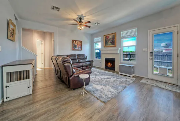 a living room with furniture and a fireplace