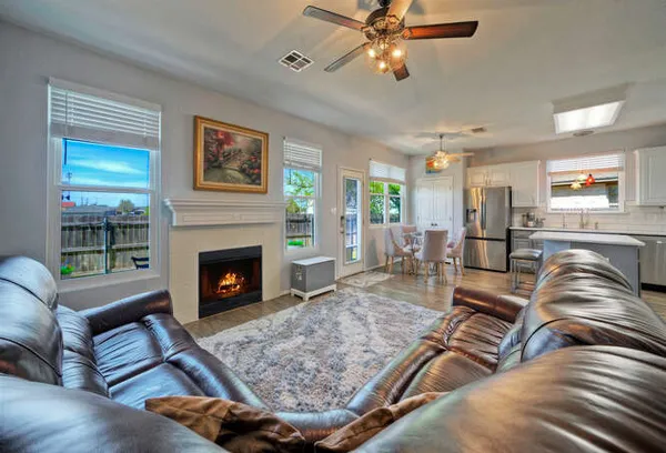 a living room with furniture or couch and a fireplace