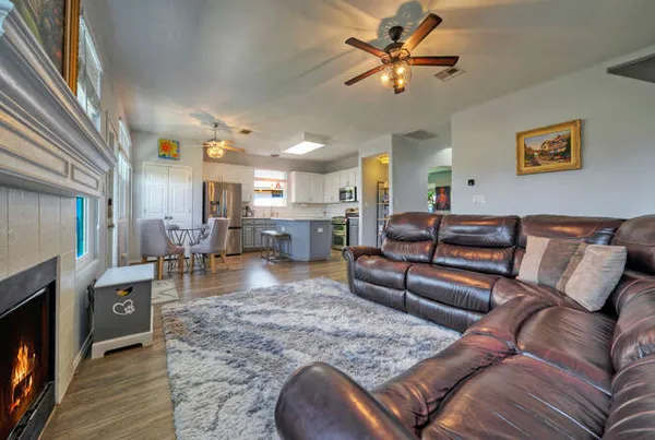 a living room with furniture and a fireplace