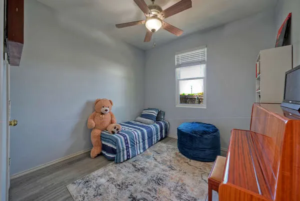 a bedroom with bed and a window