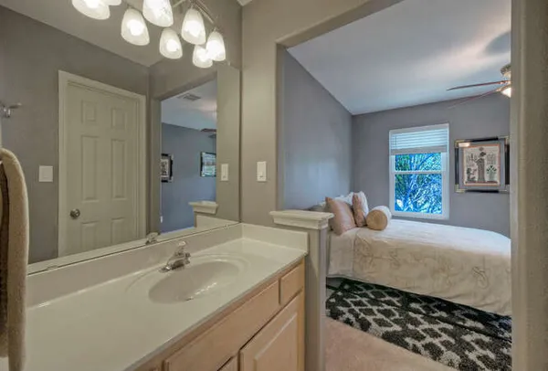 a bedroom with a bed and a dresser