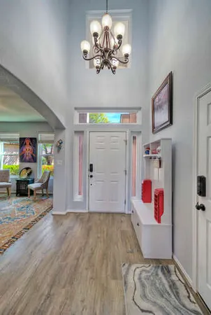 a view of livingroom with hardwood floor and a ceiling fan