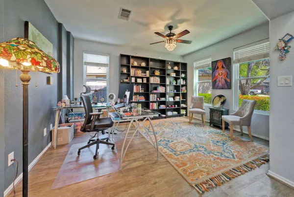 a living room filled with furniture and a chandelier