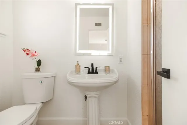 a bathroom with a sink and mirror