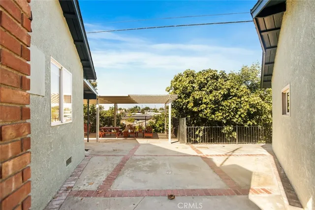 an aerial view of a house with large trees