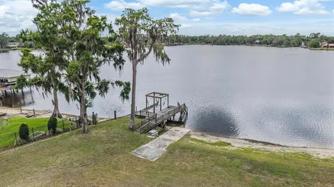 a view of a lake with a yard