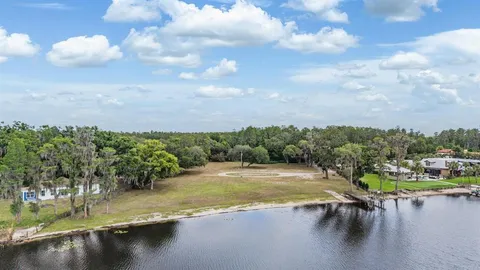 a view of a lake with a yard