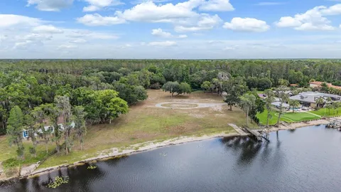 a view of a lake with a yard