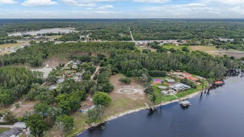 an aerial view of a golf course with parking space