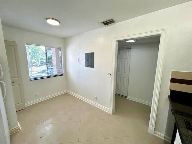 a view of an empty room with a window