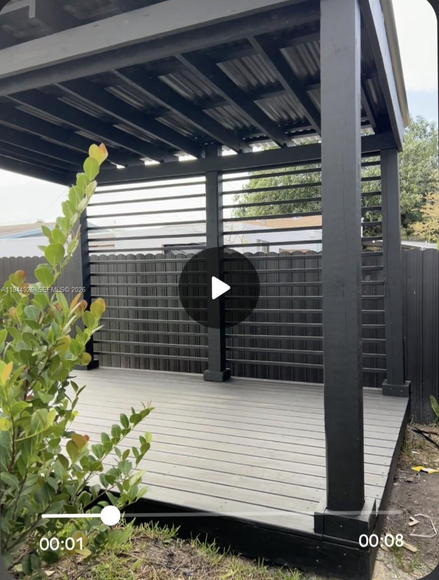 8012 Northwest 14th Place, Unit A Miami, FL 33147 - Photo 11 of 12 a view of outdoor space and wooden deck