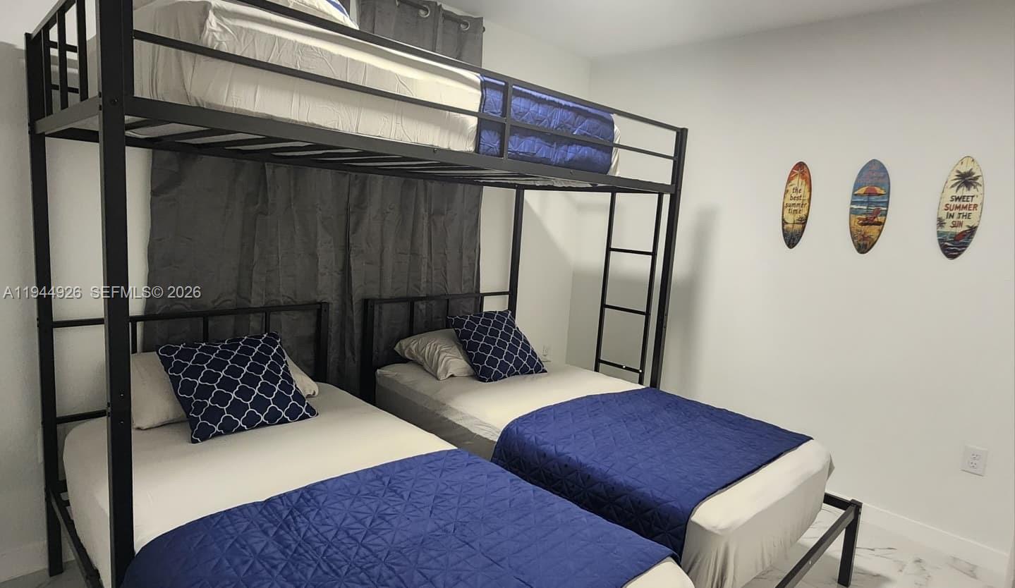 8012 Northwest 14th Place, Unit A Miami, FL 33147 - Photo 9 of 12 a living room with furniture