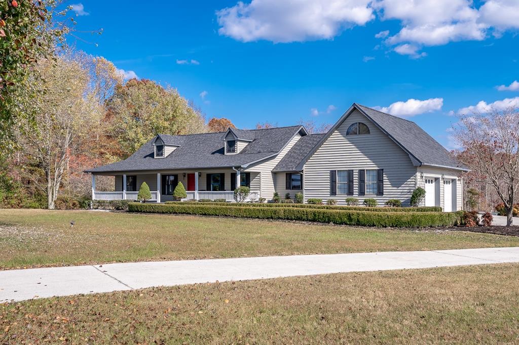 416 O'Neal Road Livingston, TN 38570 - Photo 1 of 22 a front view of a house with a garden
