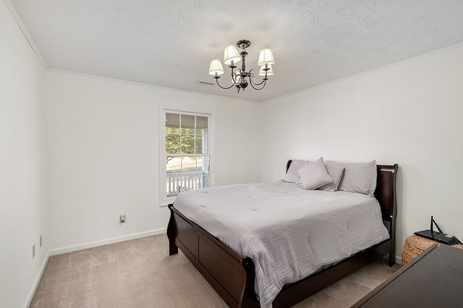 416 O'Neal Road Livingston, TN 38570 - Photo 14 of 22 a bedroom with a bed and chandelier