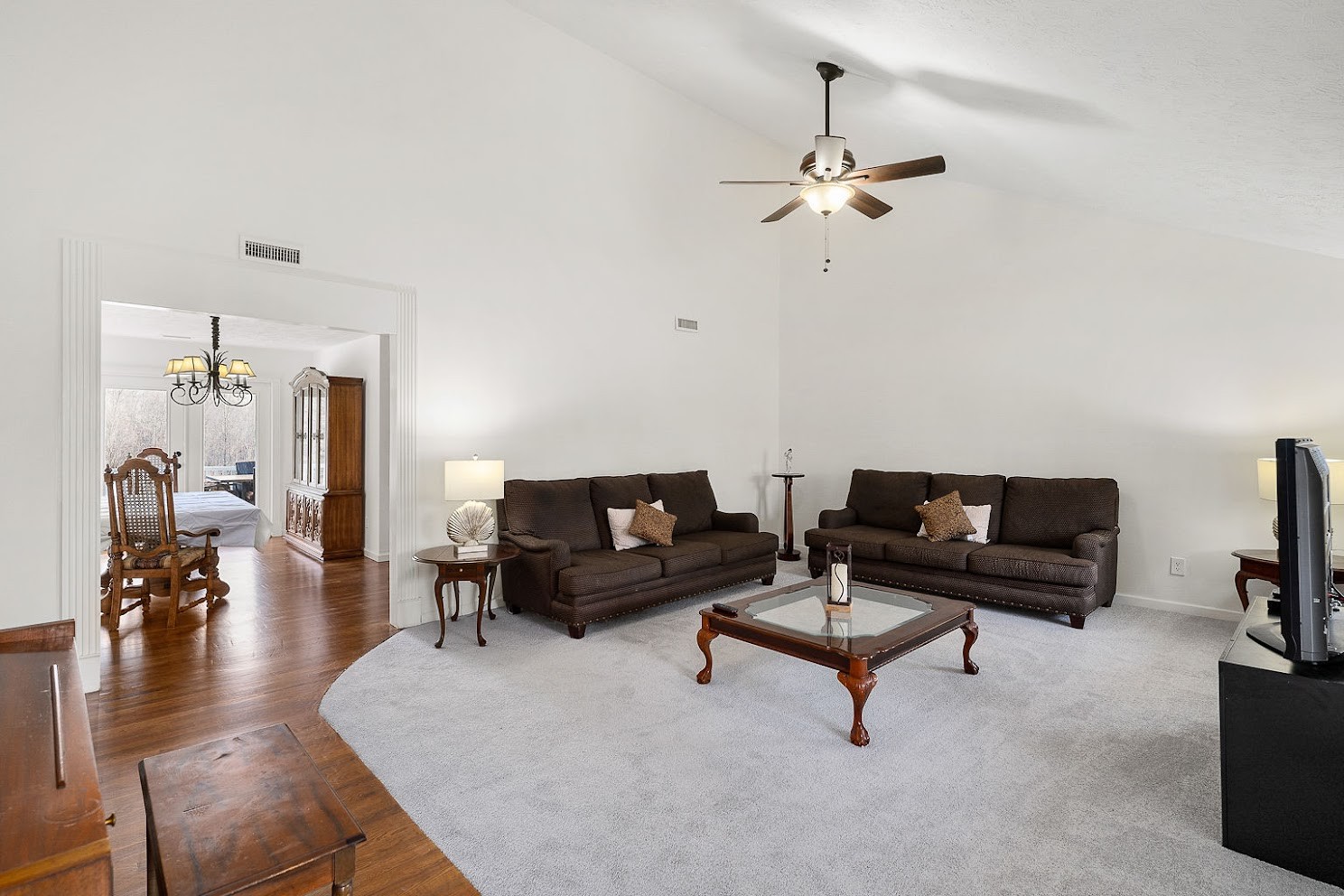 416 O'Neal Road Livingston, TN 38570 - Photo 4 of 22 a living room with furniture and a chandelier