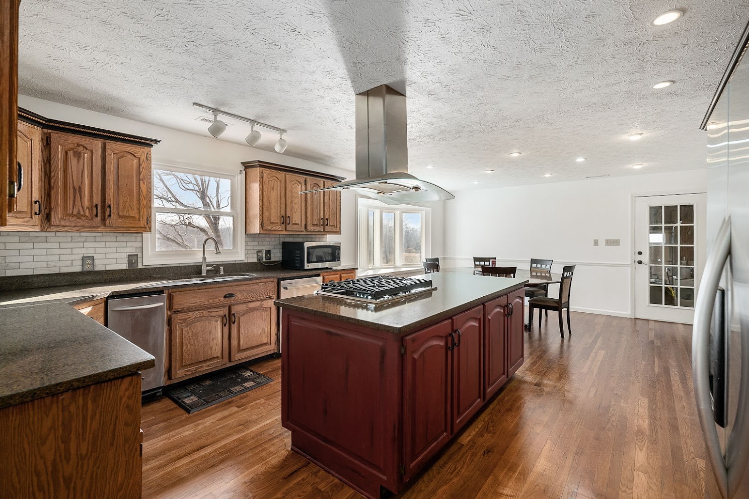 416 O'Neal Road Livingston, TN 38570 - Photo 8 of 22 a kitchen with stainless steel appliances granite countertop a stove and a sink