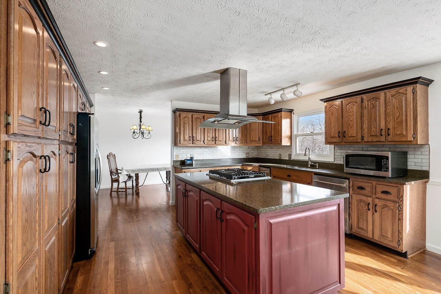 416 O'Neal Road Livingston, TN 38570 - Photo 9 of 22 a kitchen with granite countertop a sink cabinets and stainless steel appliances