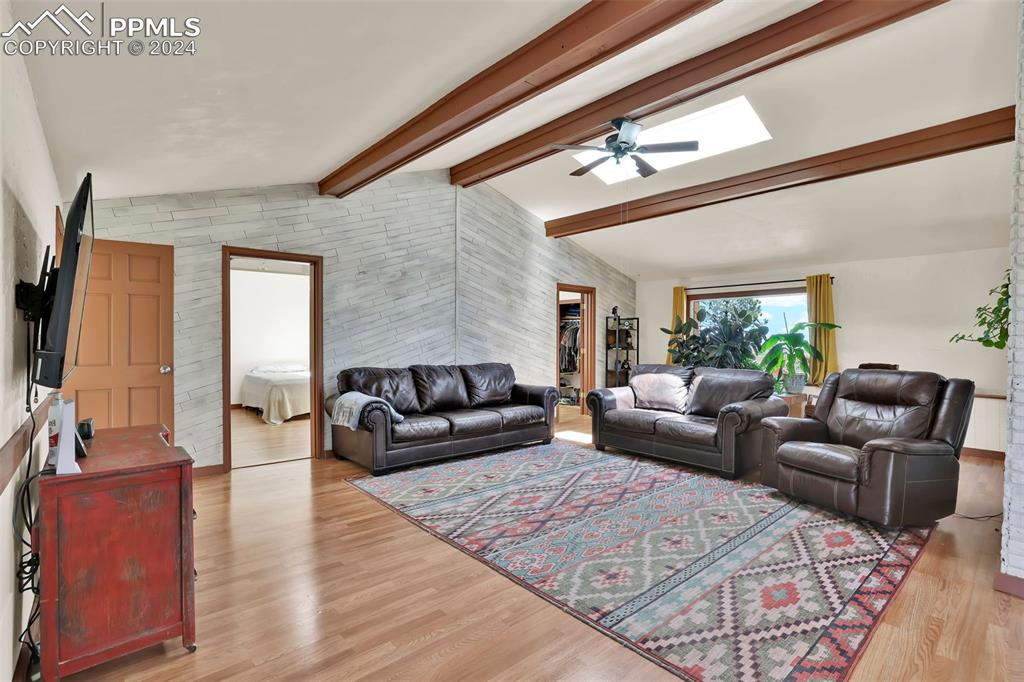 6910 Sengbeil Road Yoder, CO 80864 - Photo 17 of 50 a living room with furniture and a flat screen tv