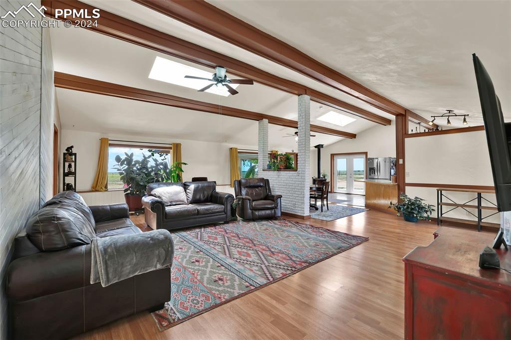 6910 Sengbeil Road Yoder, CO 80864 - Photo 18 of 50 a living room with furniture and a flat screen tv