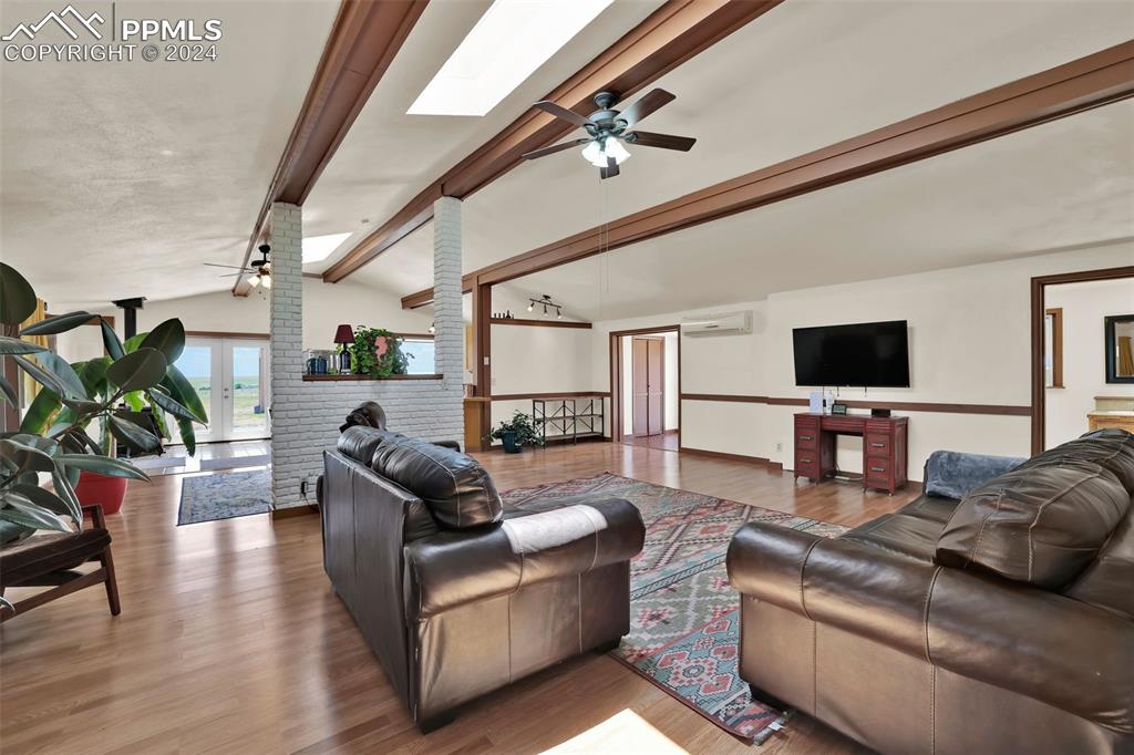 6910 Sengbeil Road Yoder, CO 80864 - Photo 19 of 50 a living room with furniture and a flat screen tv
