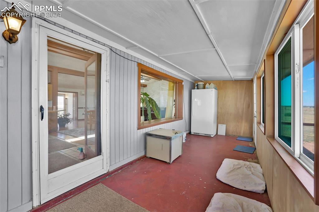 6910 Sengbeil Road Yoder, CO 80864 - Photo 26 of 50 a view of a livingroom with furniture wooden floor and windows