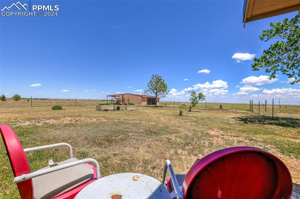 6910 Sengbeil Road Yoder, CO 80864 - Photo 31 of 50 a view of swimming pool with outdoor seating