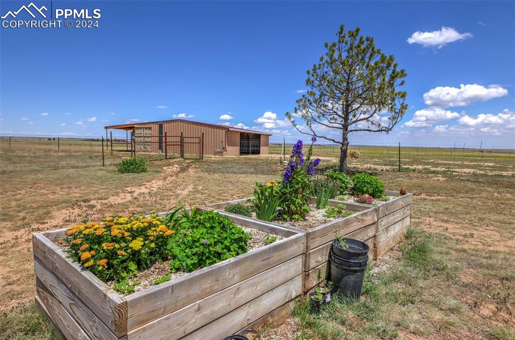 6910 Sengbeil Road Yoder, CO 80864 - Photo 32 of 50 a view of a garden with an outdoor seating