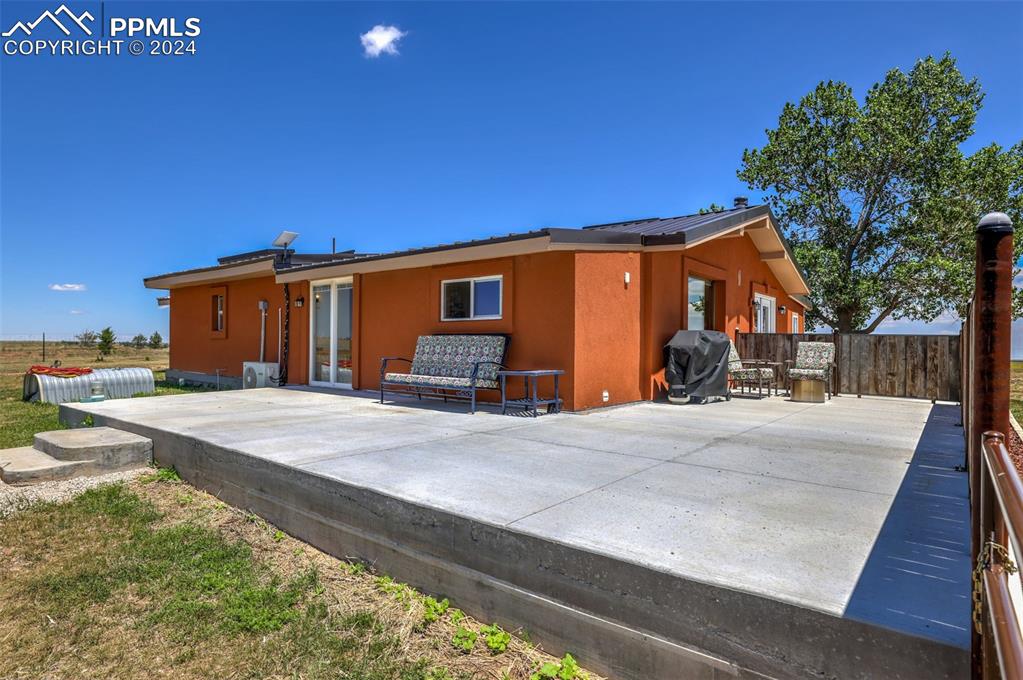 6910 Sengbeil Road Yoder, CO 80864 - Photo 5 of 50 a front view of a house with a yard and garage