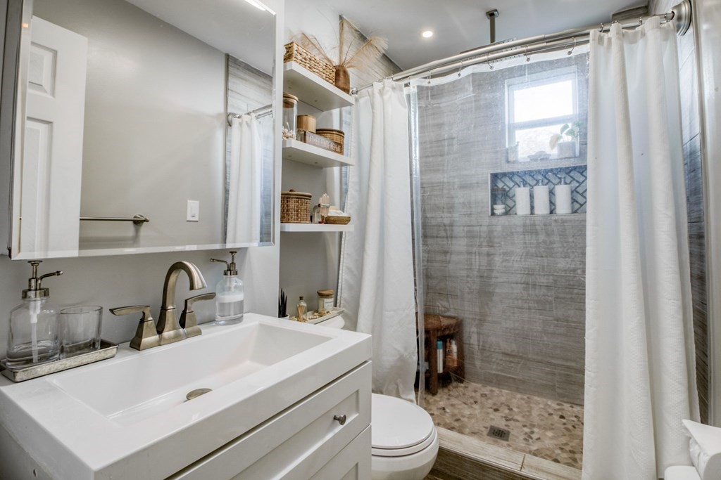 28 Rutledge Avenue Springfield, MA 01105 - Photo 16 of 22 a bathroom with a sink a toilet and shower