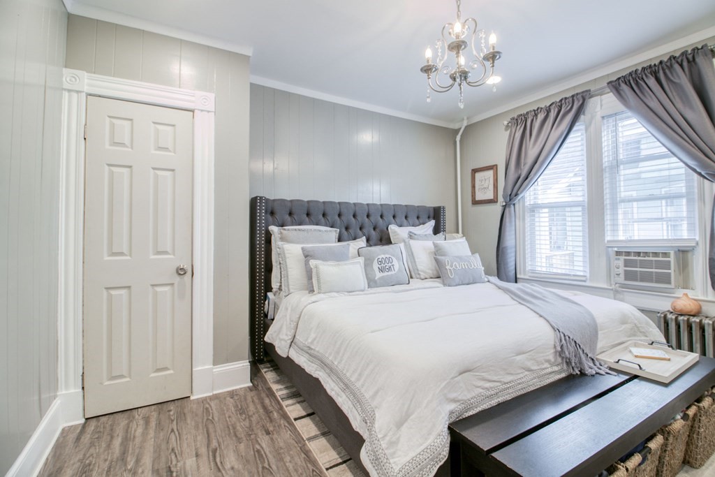 28 Rutledge Avenue Springfield, MA 01105 - Photo 17 of 22 a bedroom with a bed and a chandelier