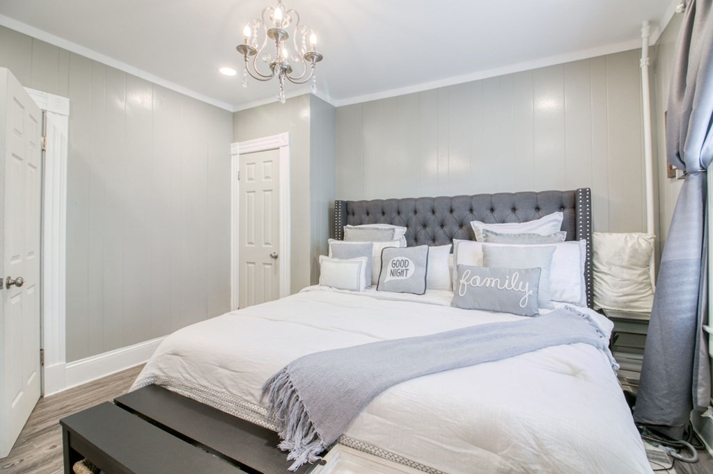 28 Rutledge Avenue Springfield, MA 01105 - Photo 18 of 22 a bedroom with a bed and a chandelier