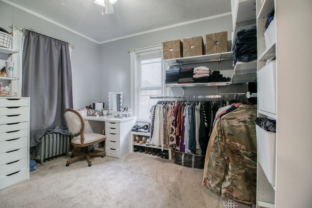 28 Rutledge Avenue Springfield, MA 01105 - Photo 21 of 22 a view of walk in closet with clothes and shoes
