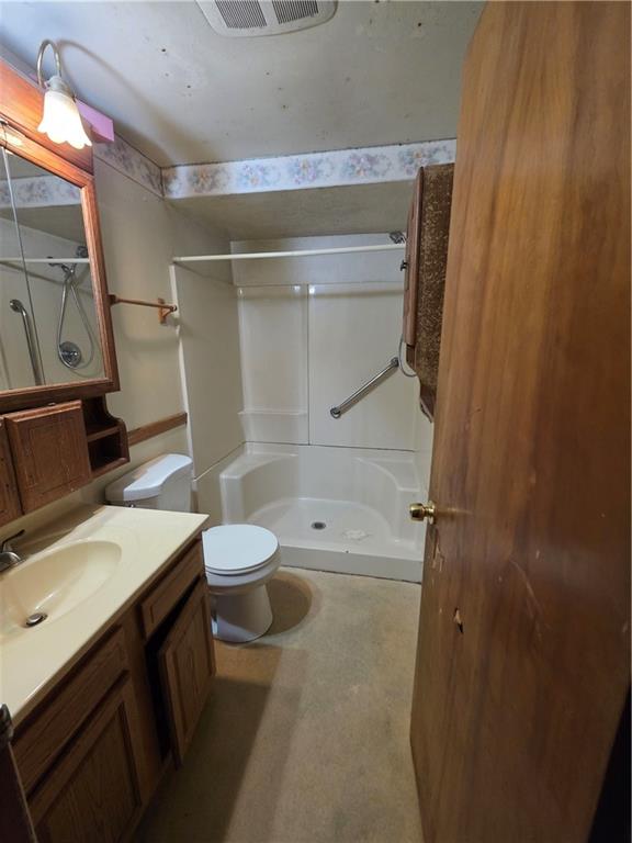 1852 Virginia Via Washington, PA 15301 - Photo 10 of 14 a bathroom with a sink a toilet and shower