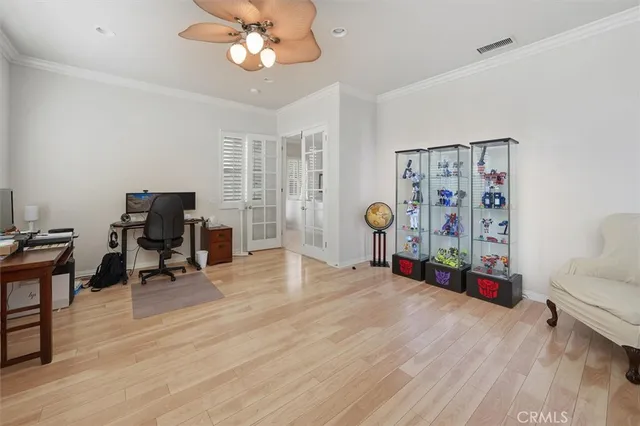 a view of a livingroom with workspace and a window