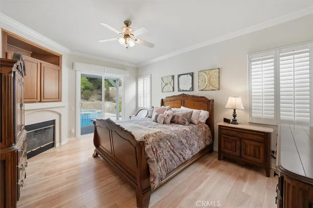 a bedroom with a bed and a fireplace