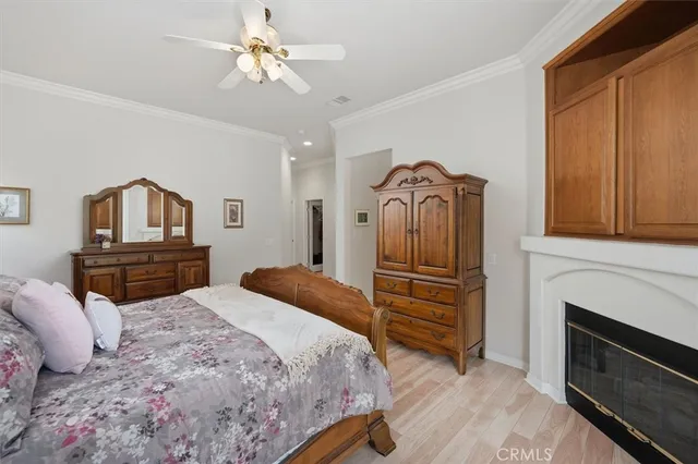 a bedroom with a bed dresser and a window