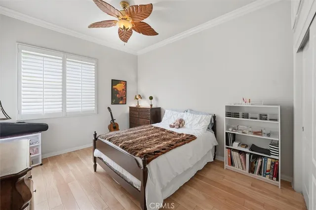 a living room with a bed and a table in it