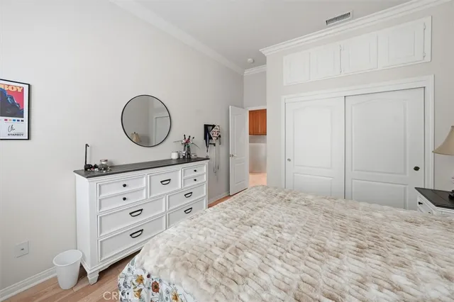 a bedroom with a bed and a closet