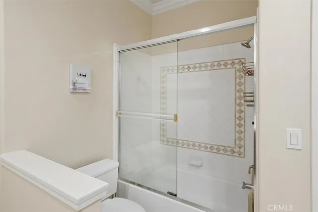 a bathroom with a shower and toilet