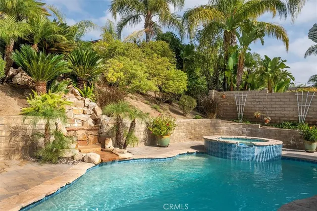 a view of swimming pool with a yard
