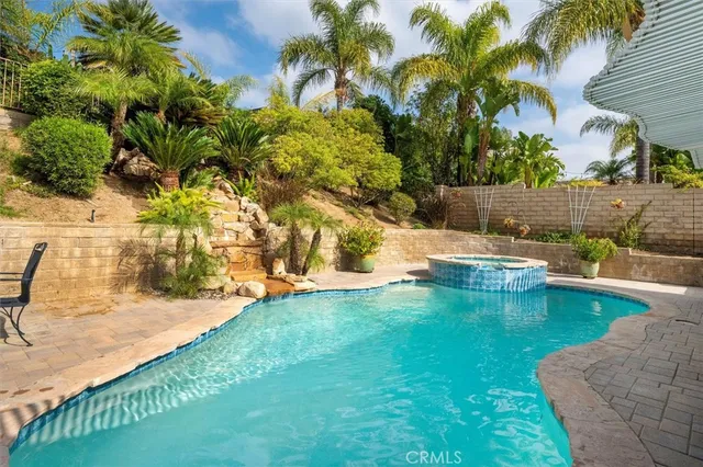 a view of a swimming pool with a yard