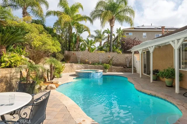 a view of a swimming pool with a patio