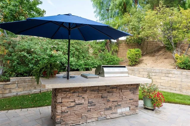 a view of a backyard with under an umbrella